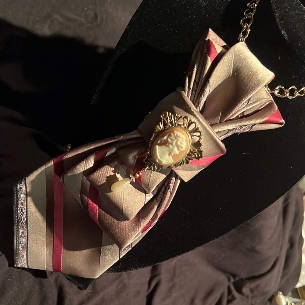 Elegant Brown and Red Scarf with Cameo Detail
